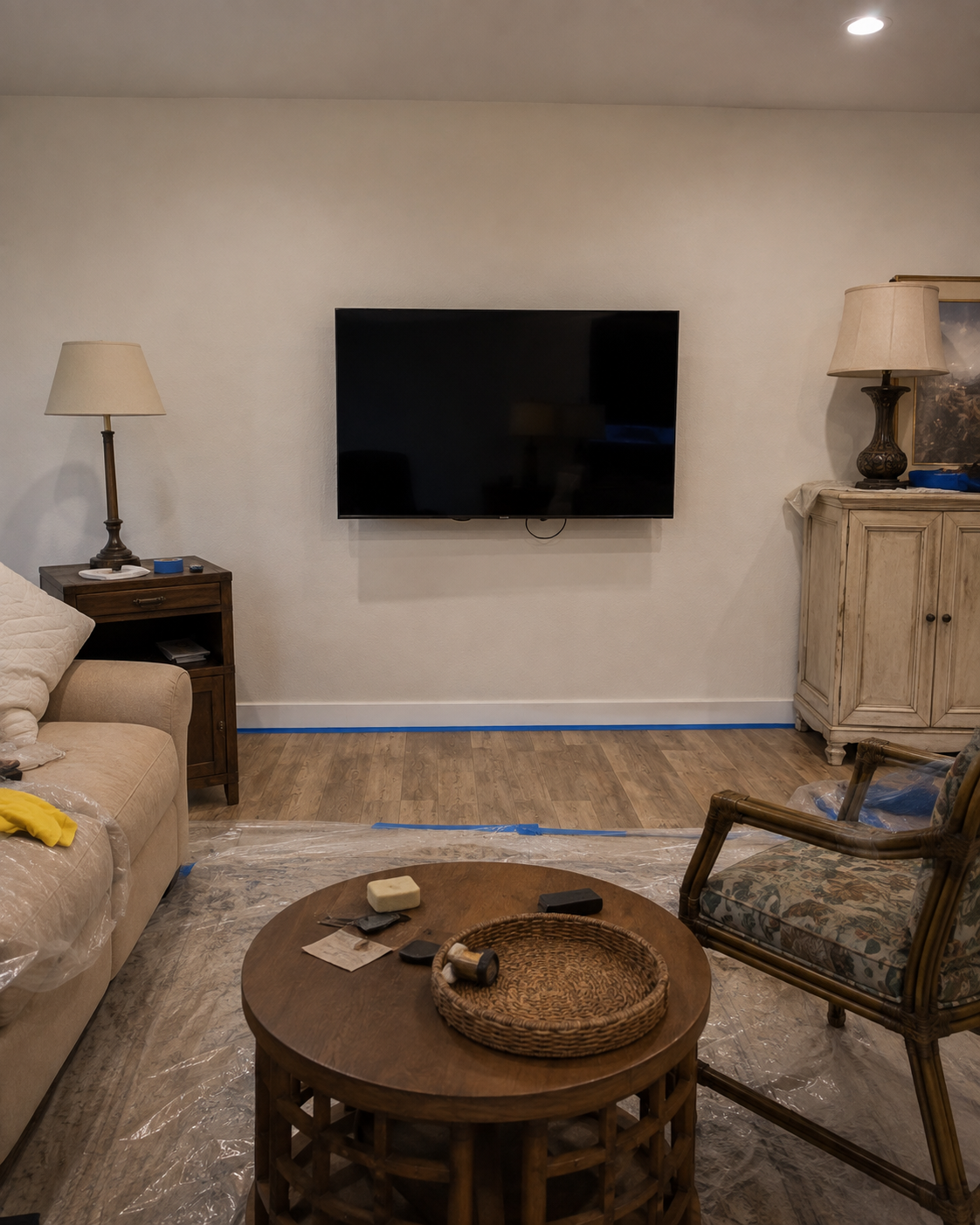 Before view of the Naples living room with a television mounted directly on a plain wall before the custom fireplace TV wall was built.